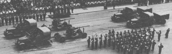 C4P tractors of the 1st AA Arty Rgt. towing 75mm wz.36 St. AA guns on parade [source 2].